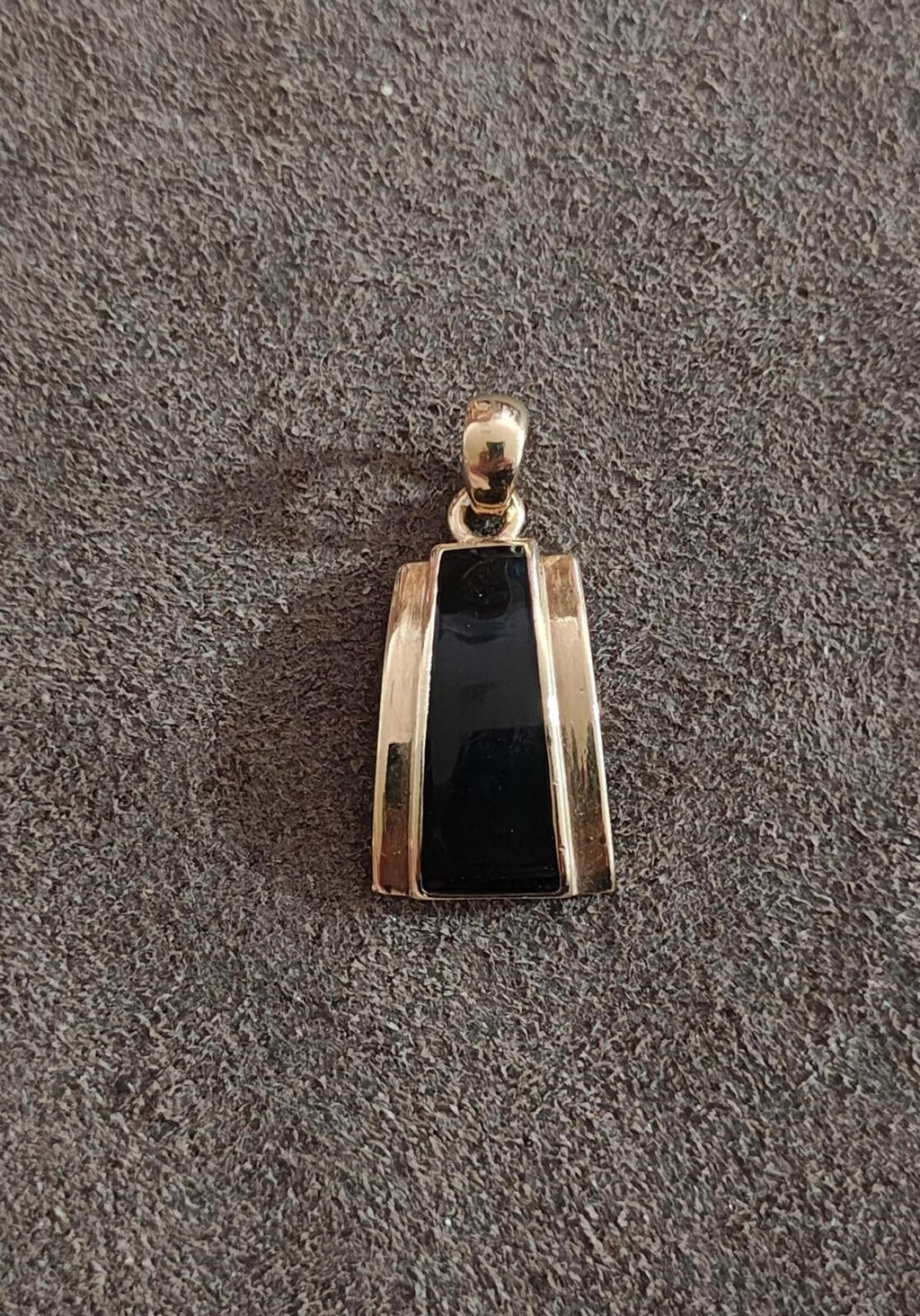 Black enamel gold-tone slide pendant, front view with rectangular center and loop bail