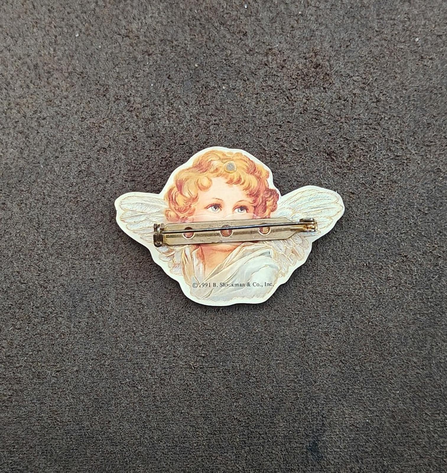 Angel cherub brooch back with gold-tone pin and ©1991 B. Shackman & Co., Inc. stamp