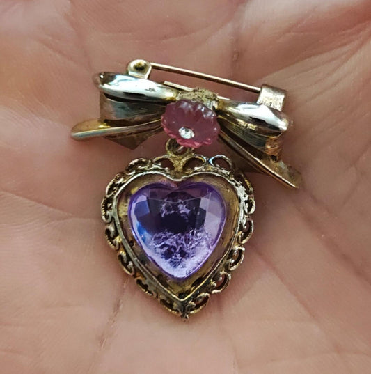 1980s Gold Tone Bow With Pink Flower & Filigree Edged Purple Stone Heart Brooch