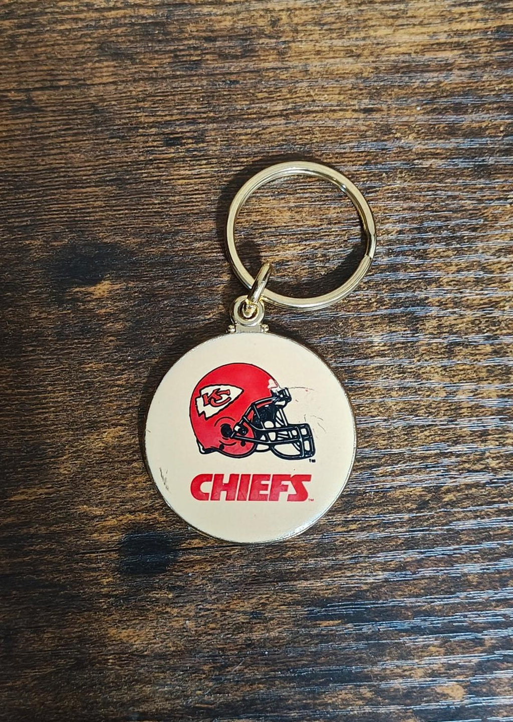 Small Kansas City Chiefs keychain with gold ring and round white enamel logo medallion