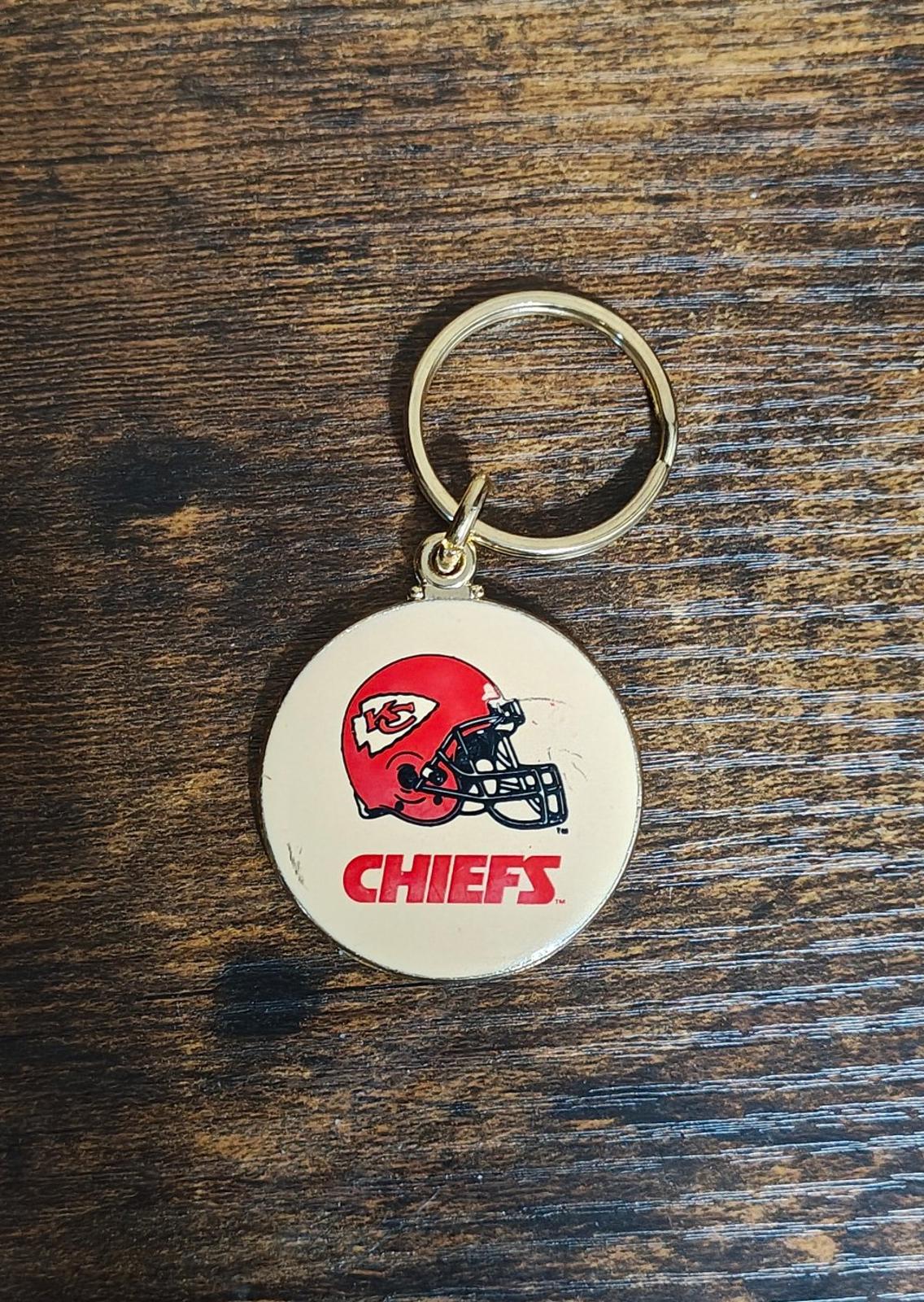 Small Kansas City Chiefs keychain with gold ring and round white enamel logo medallion