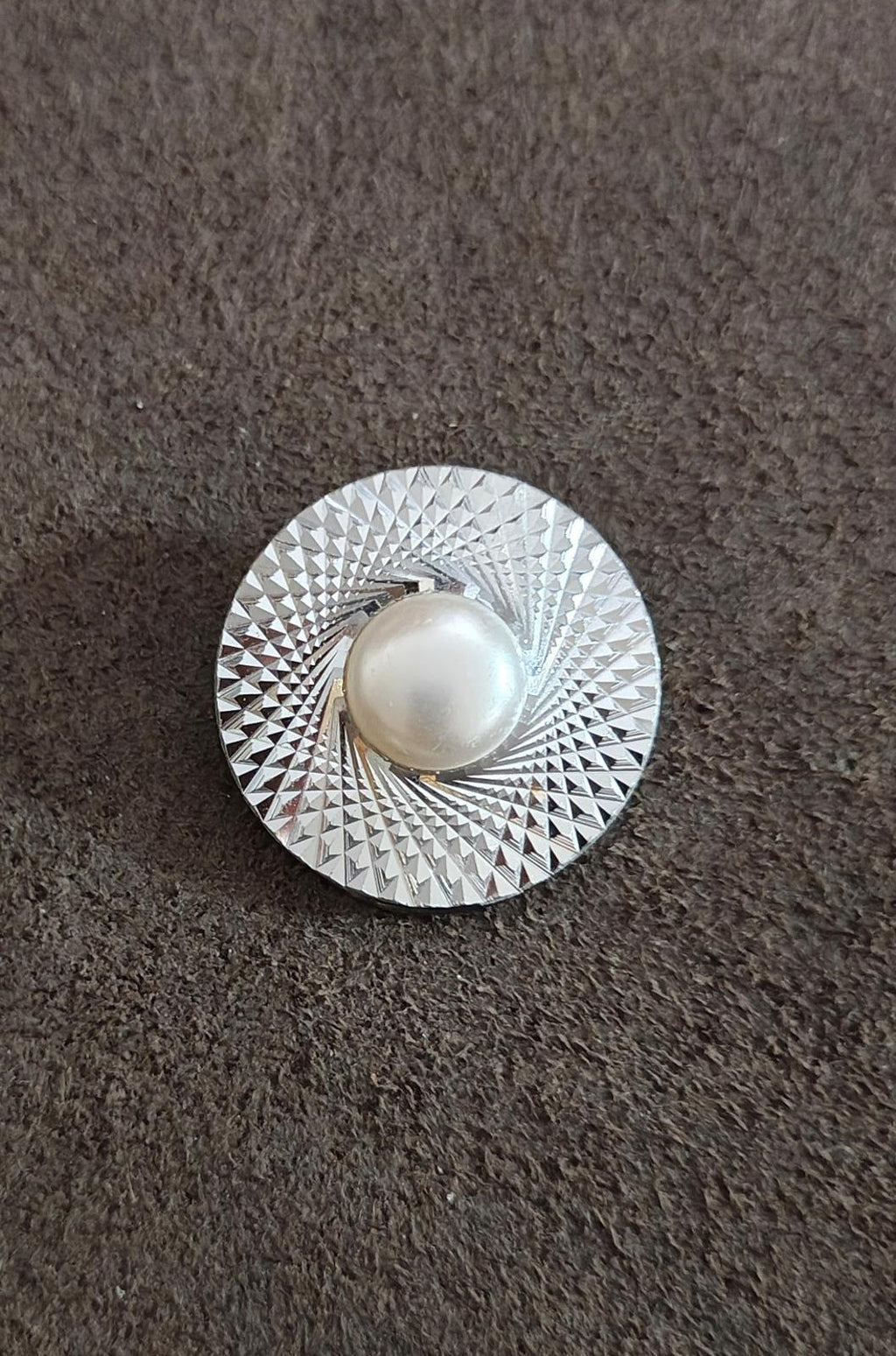 Round silver-tone scarf clip featuring diamond-cut shine and white faux pearl