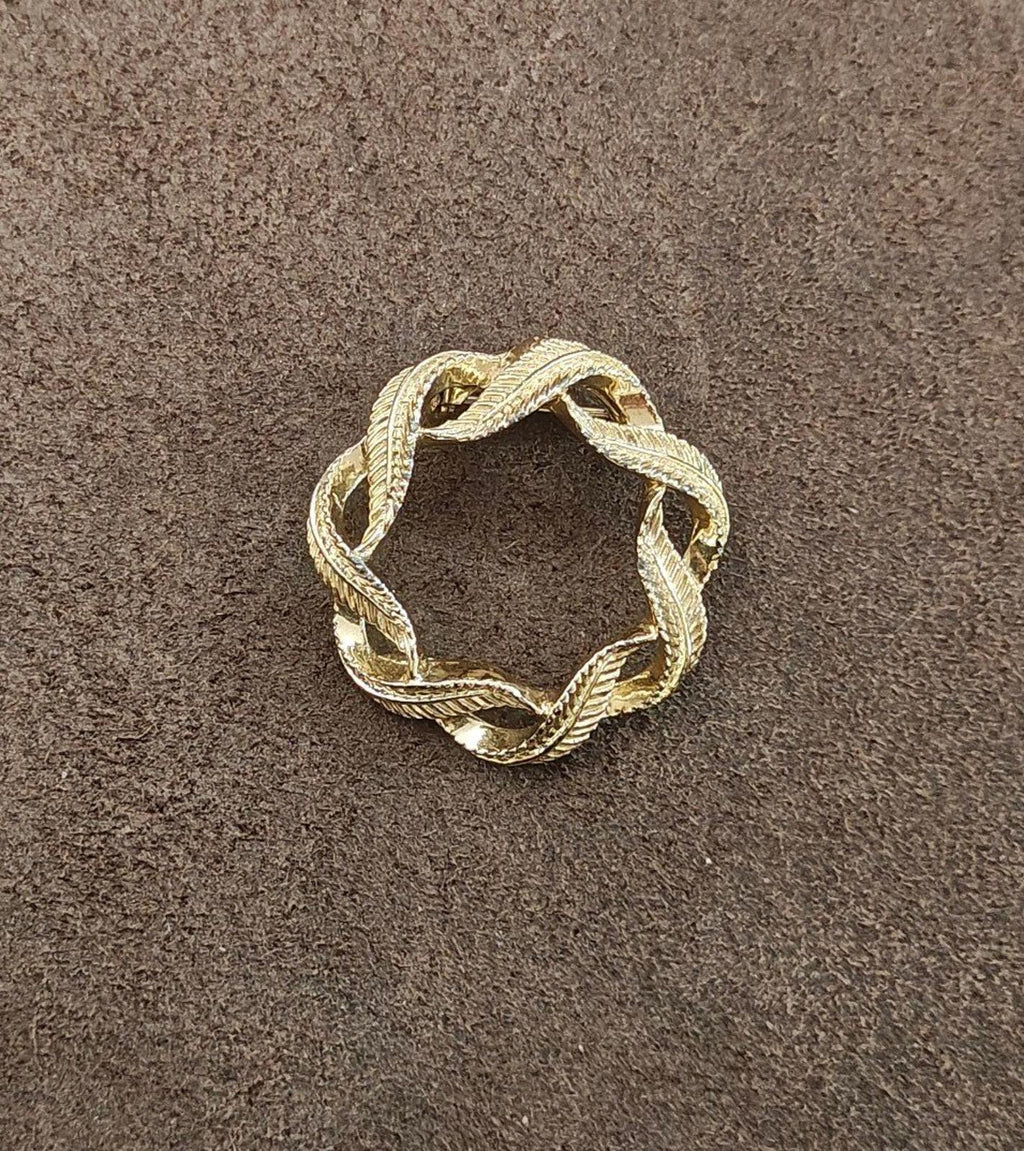 Gold-tone circular wreath brooch pin with rope-textured leaf border and red enamel