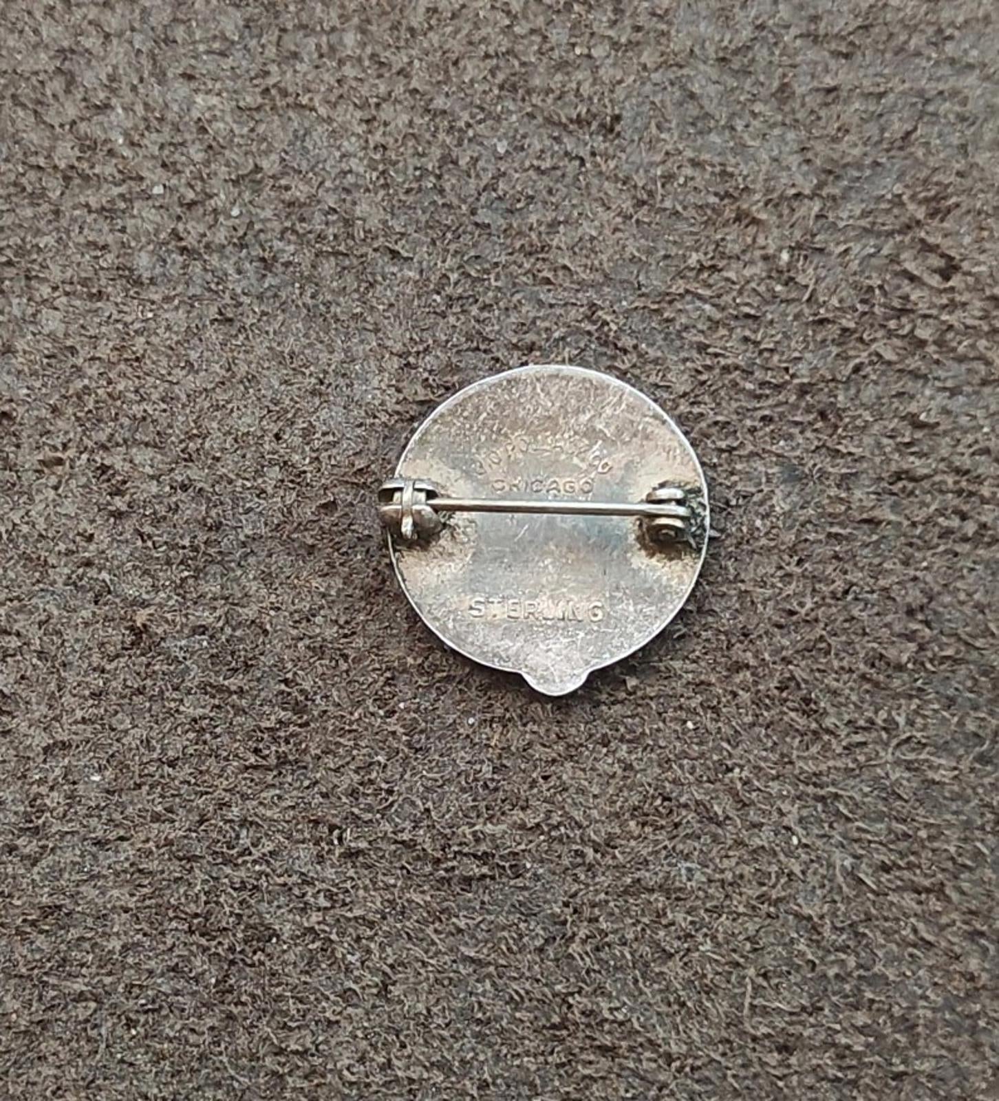 Silver back of service award pin with horizontal safety bar and metal pin clasp