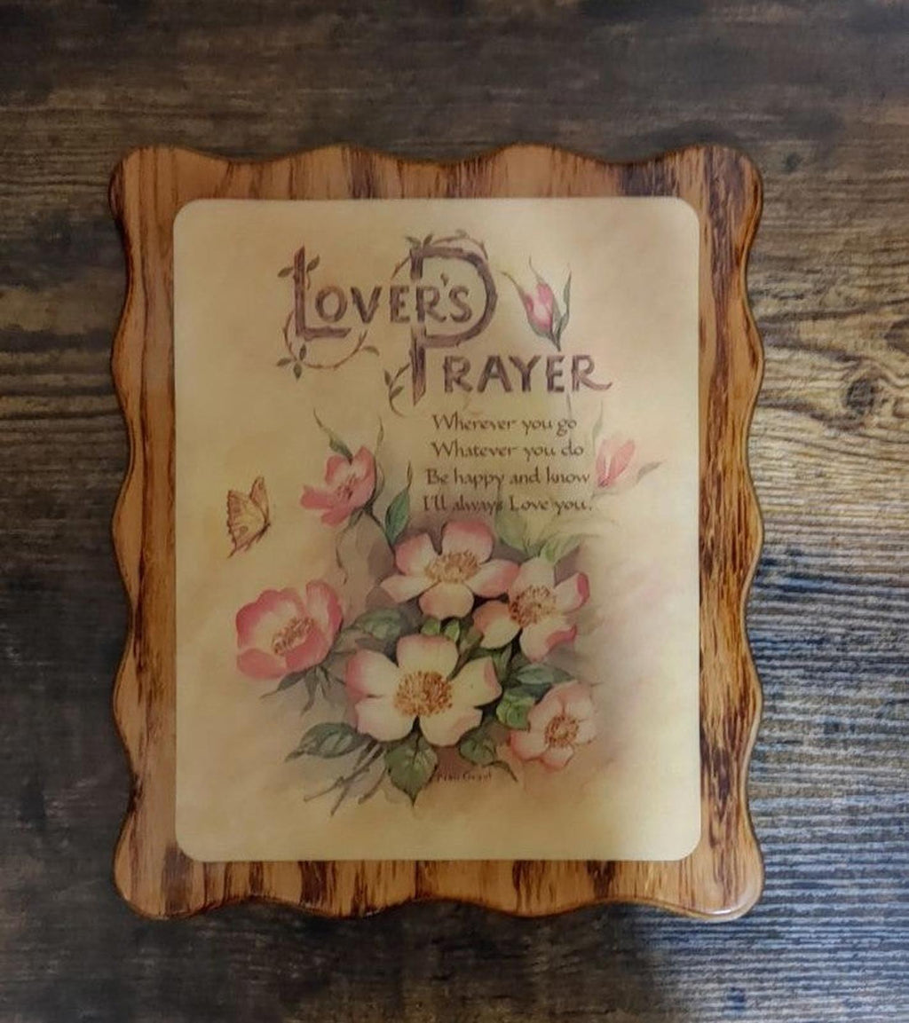Brown wooden wall plaque with centered 'Lover's Prayer' text and mixed bouquet flowers