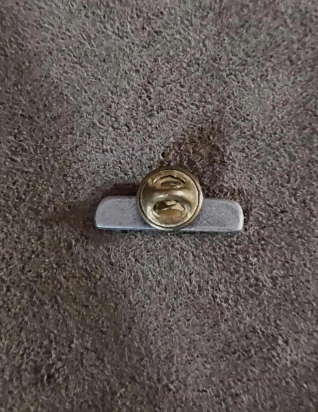 Pewter WWJD bar pin back with gold-tone safety clasp