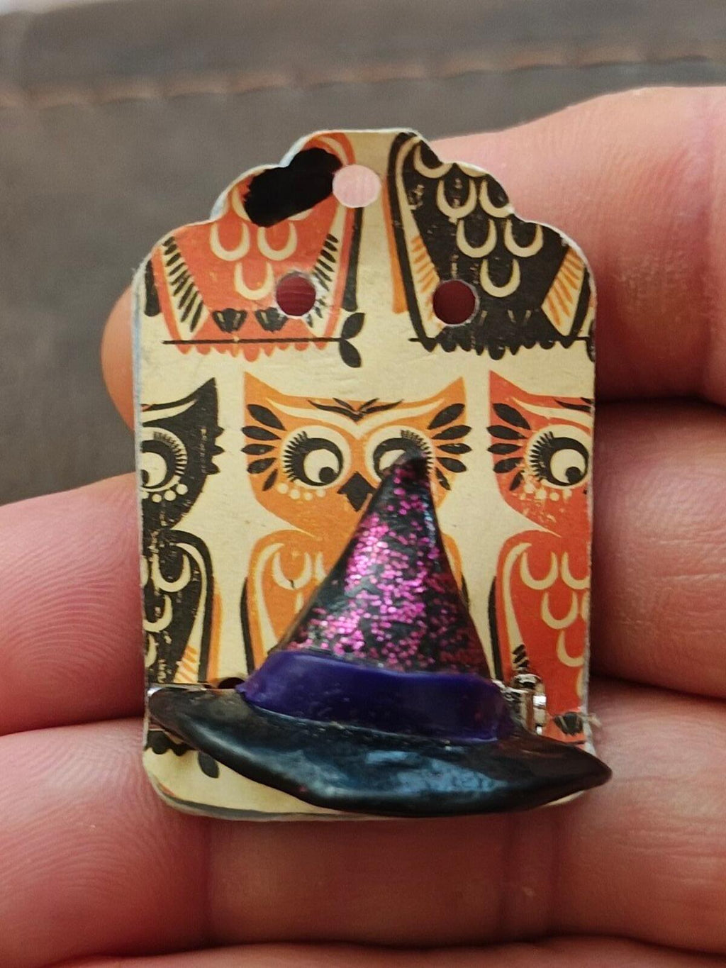 Handmade clay witch hat brooch with purple glitter cone and patterned backing card