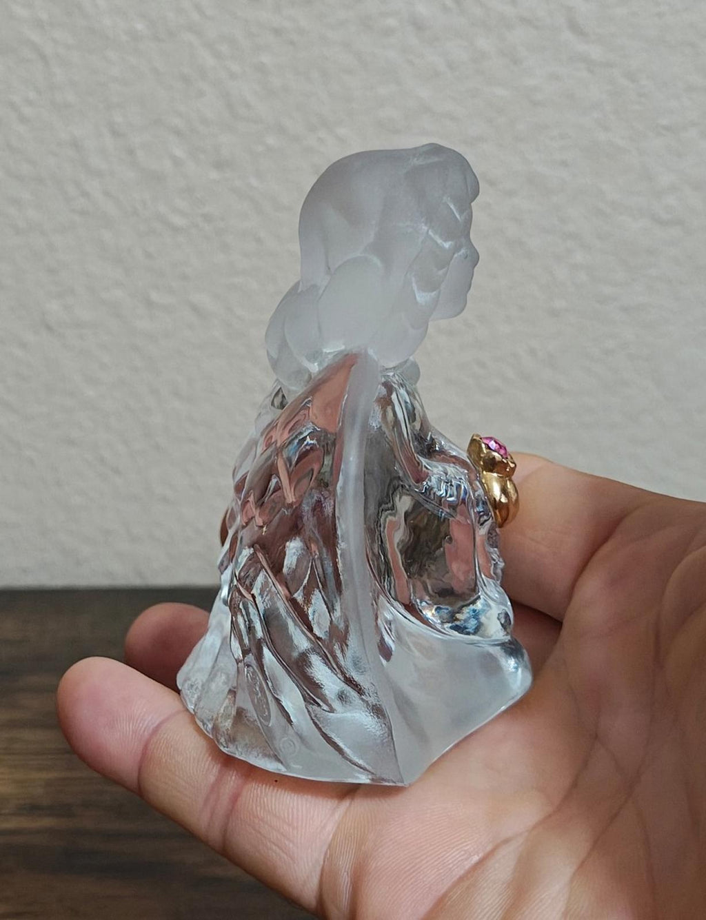 Clear glass guardian angel figurine, rear angle showing flowing glass drapery