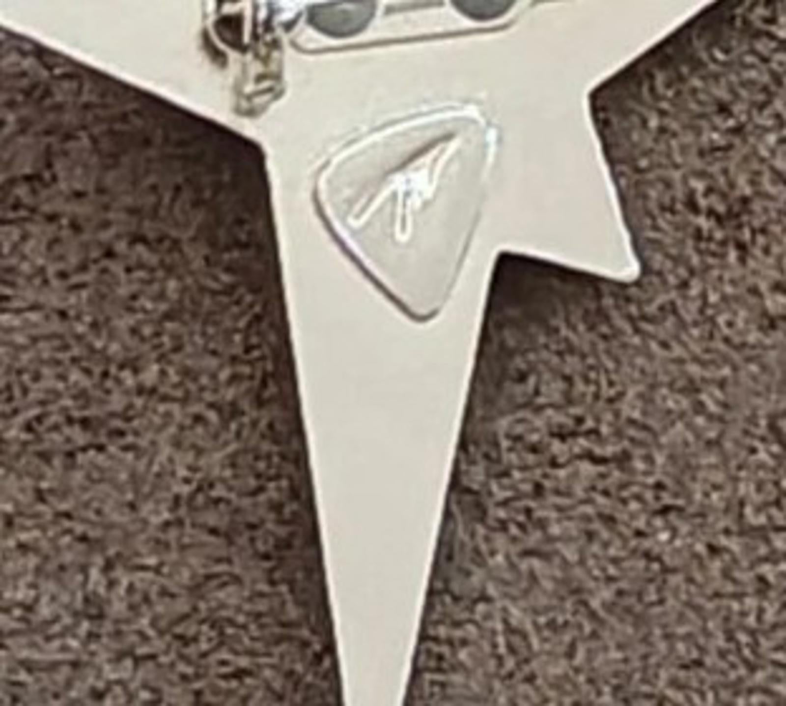 Close-up of star brooch reverse showing pin hinge and clasp details