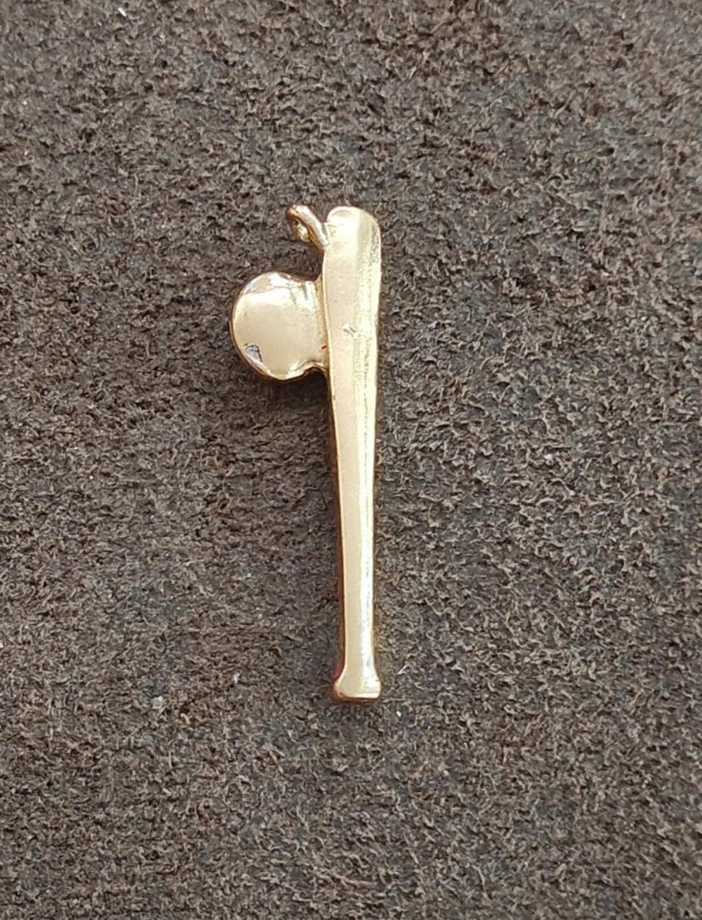 Gold-tone side view of baseball bat charm with small ball detail