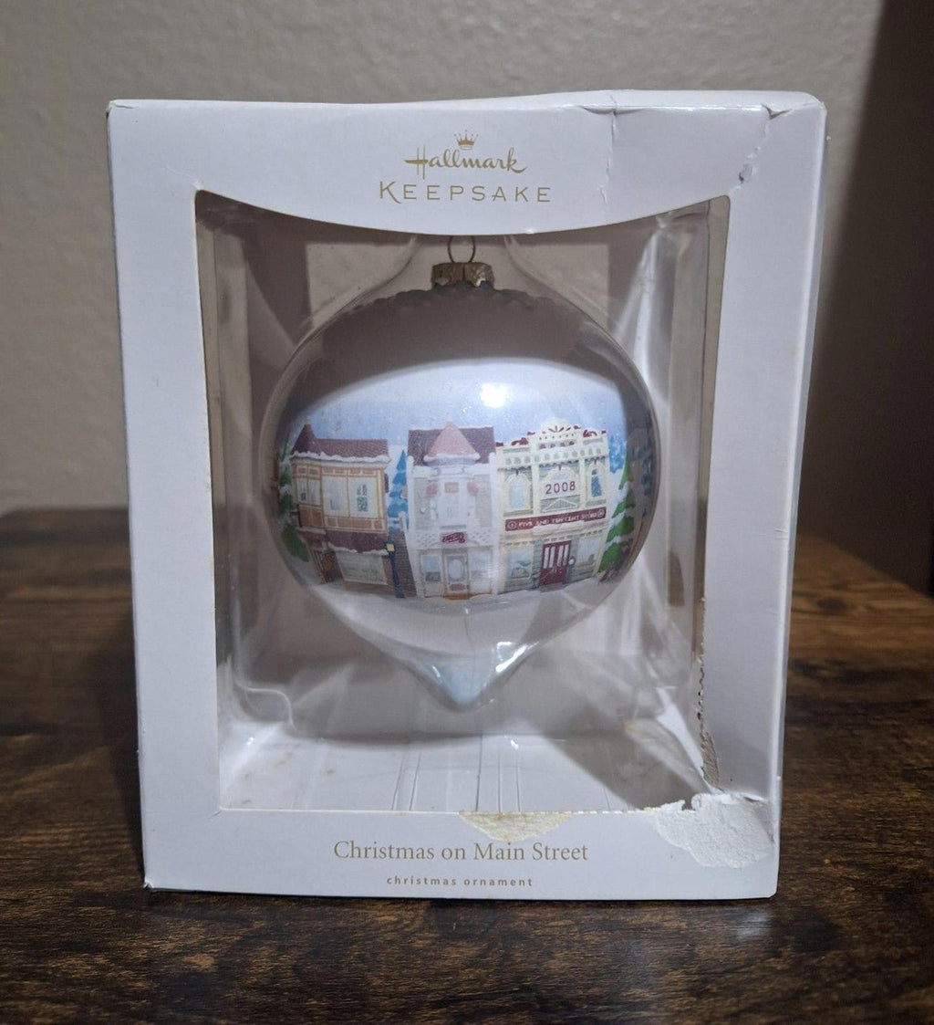Hallmark Keepsake teardrop Christmas ornament with Main Street town scene, boxed