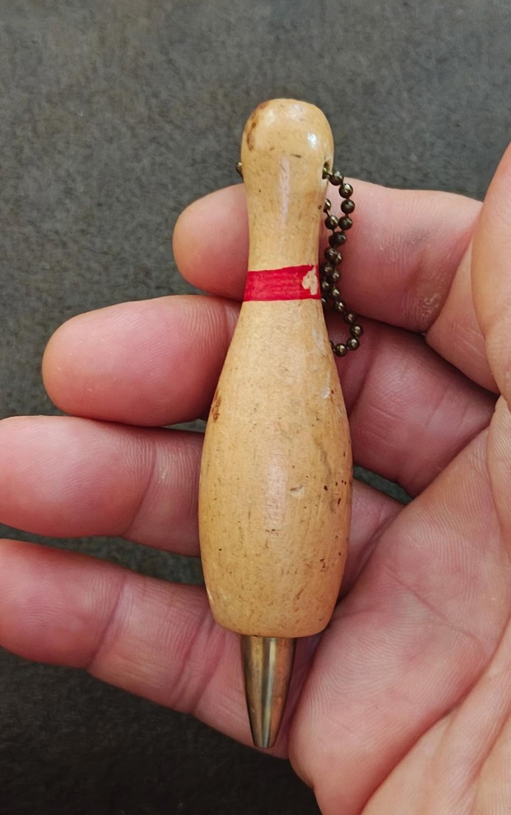 Beige wooden bowling pin mechanical pencil keychain with red band and bead chain loop