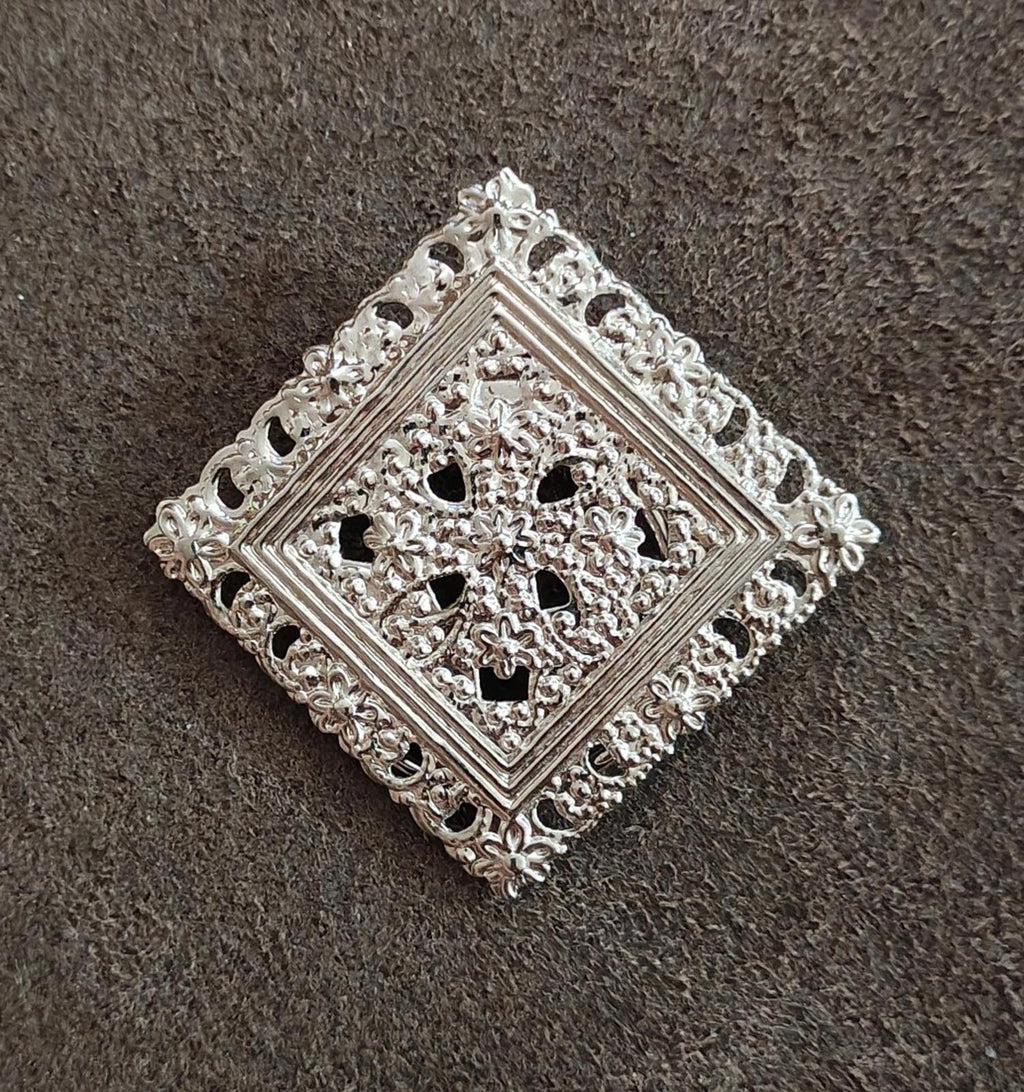 Silver-tone square open filigree scarf clip with floral cutout motif and scroll edging