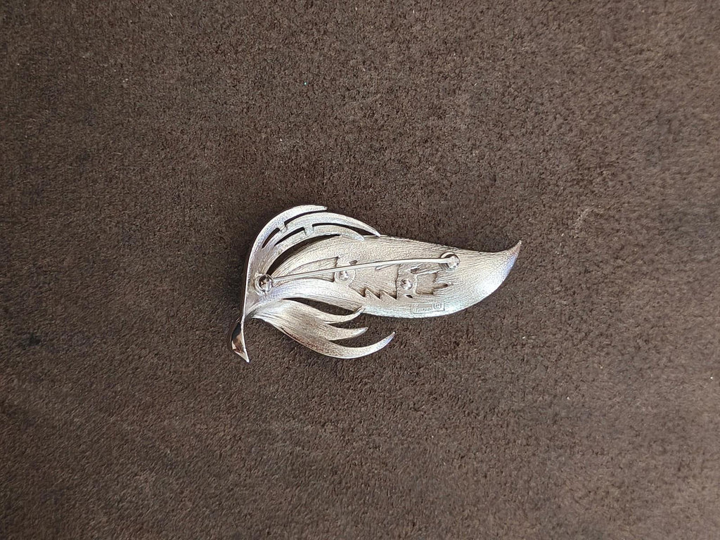 Silver-tone leaf brooch back view, hinge and clasp area visible